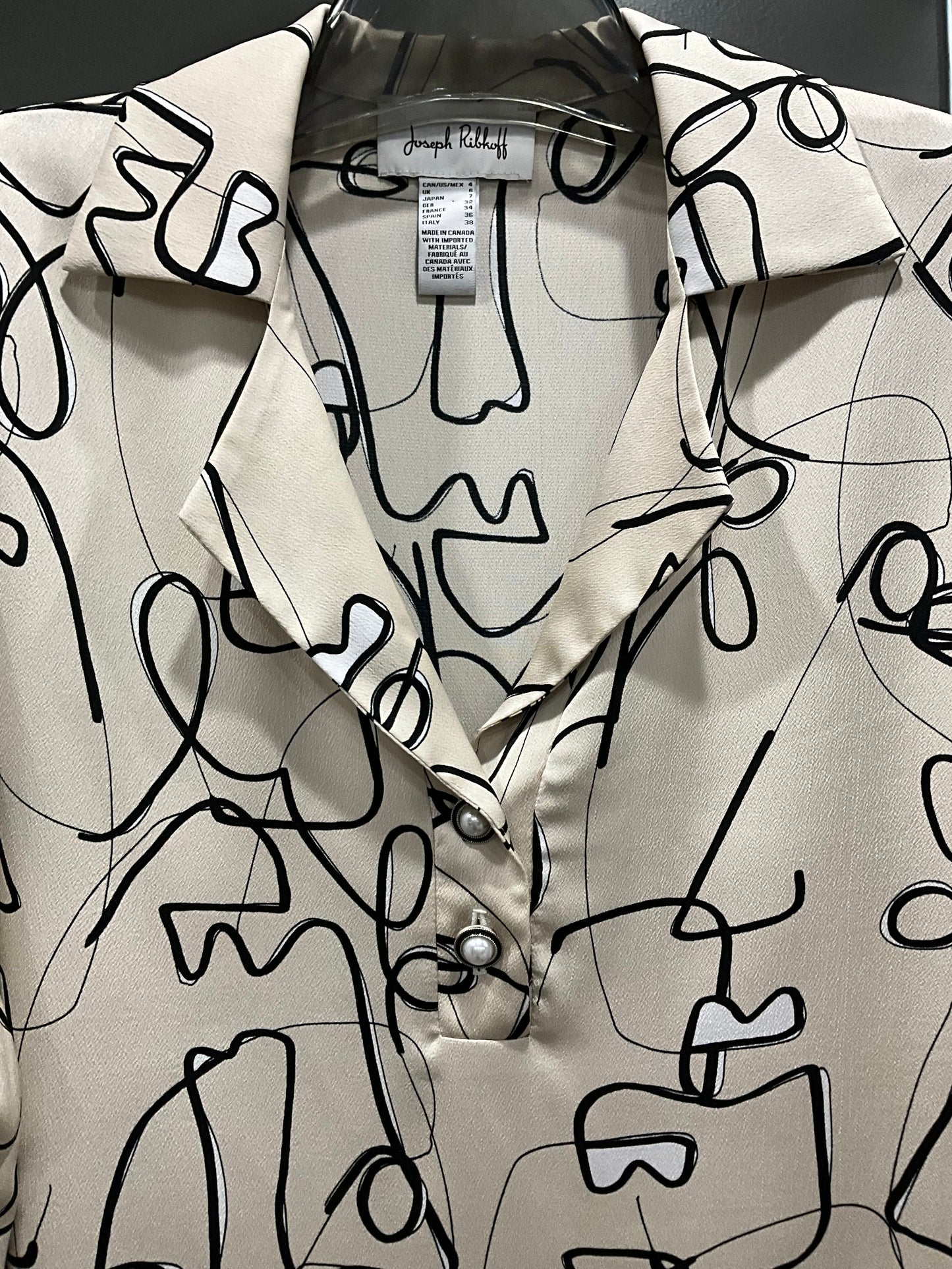 GEOMETRIC FACE BLOUSE