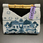 WELL TRAVELED BEADED BAG